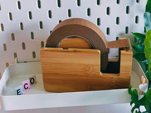 Load image into Gallery viewer, Wooden tape dispenser on a pegboard with yarn and scissors
