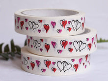 Load image into Gallery viewer, Three rolls of decorative tape with heart patterns on a light background
